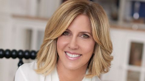 Alisyn Camerota in a white shirt poses a picture.